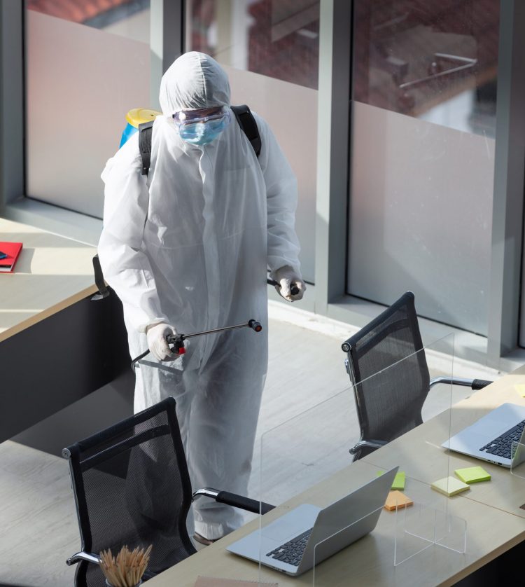 Cleaning and Disinfection at office amid the coronavirus epidemic Professional teams for disinfection efforts Infection prevention and control of epidemic Protective suit and mask.